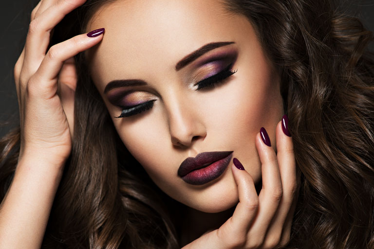 beautiful woman portrait with makeup face. nail, lips and hair