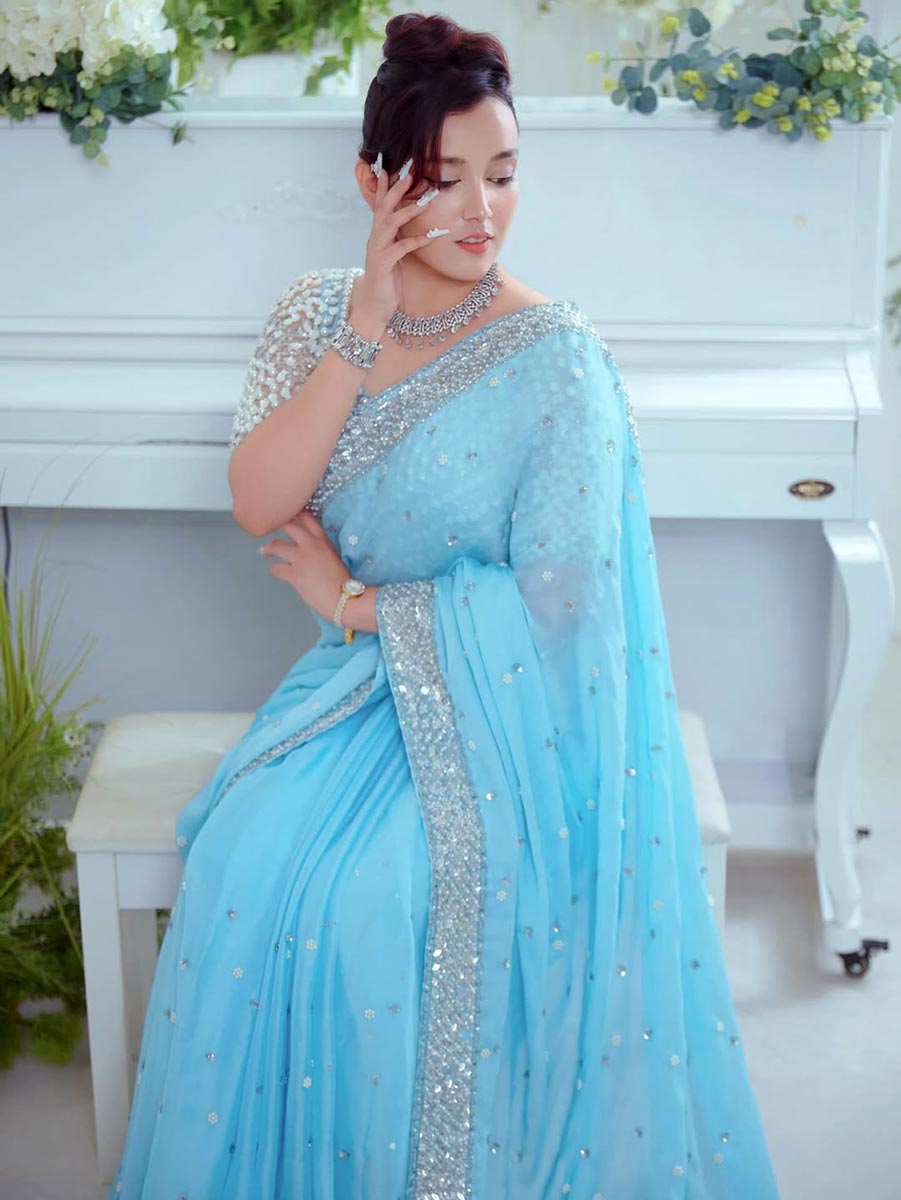 Traditional look of Nabina Ranabhat wearing a blue saree with jewelry.