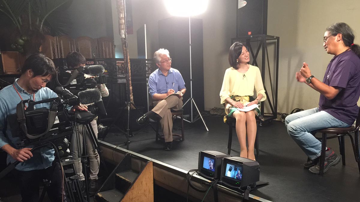 Nepathya frontman Amrit Gurung being interviewed for Japan's NHK prime time news in Tokyo in 2015.