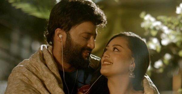 Aryan Sigdel and Karoona Shrestha in a romantic scene from the musical film Bani, sharing an intimate moment together.