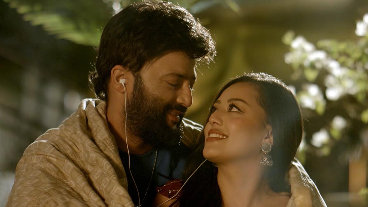 Aryan Sigdel and Karoona Shrestha in a romantic scene from the musical film Bani, sharing an intimate moment together.