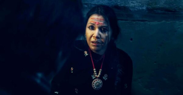 Benisha Hamal in a dark dramatic scene from the Nepali movie Kalli teaser, showing an intense emotional moment.