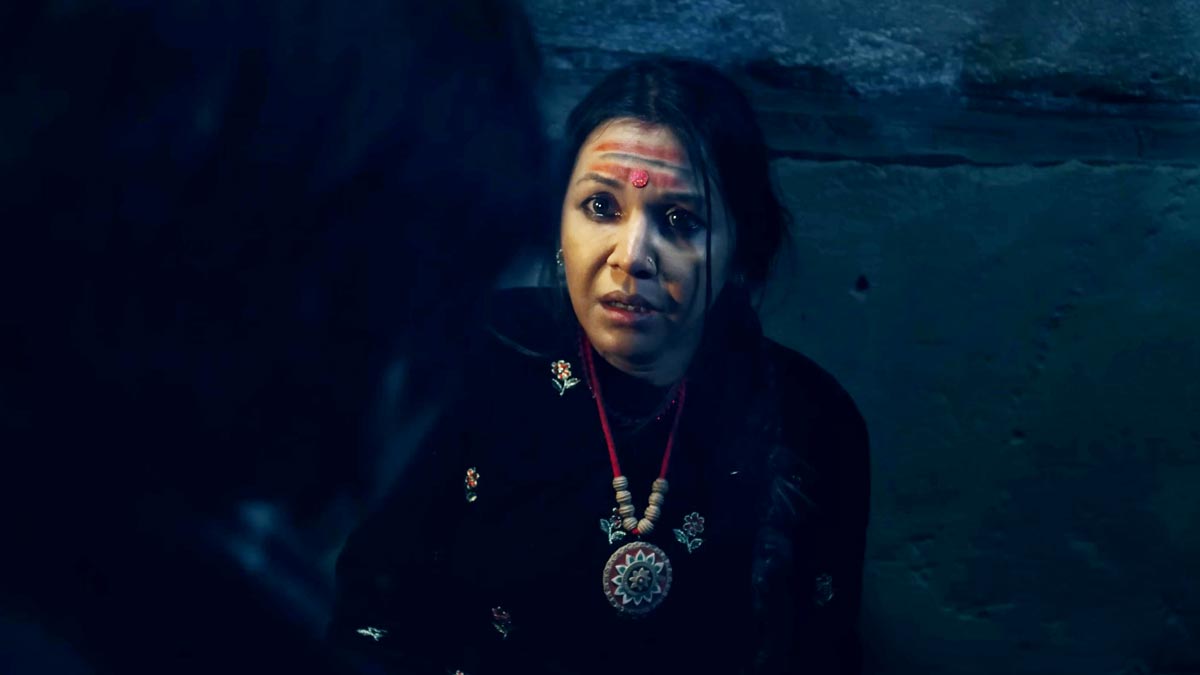 Benisha Hamal in a dark dramatic scene from the Nepali movie Kalli teaser, showing an intense emotional moment.