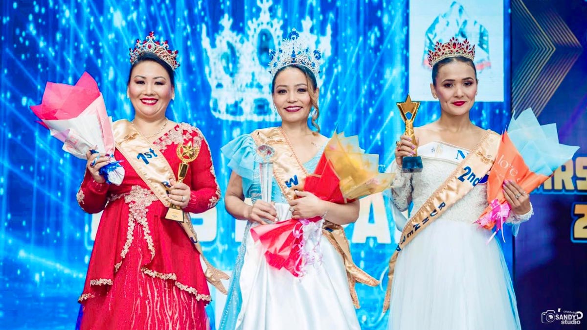 Mrs. Nepal Idol 2025 winner and runners-up posing on stage during grand finale