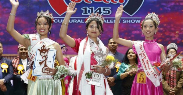 Miss Little Newa 1145 winner Suravi Bajracharya with runners-up waving on stage at cultural and talent show in Kathmandu