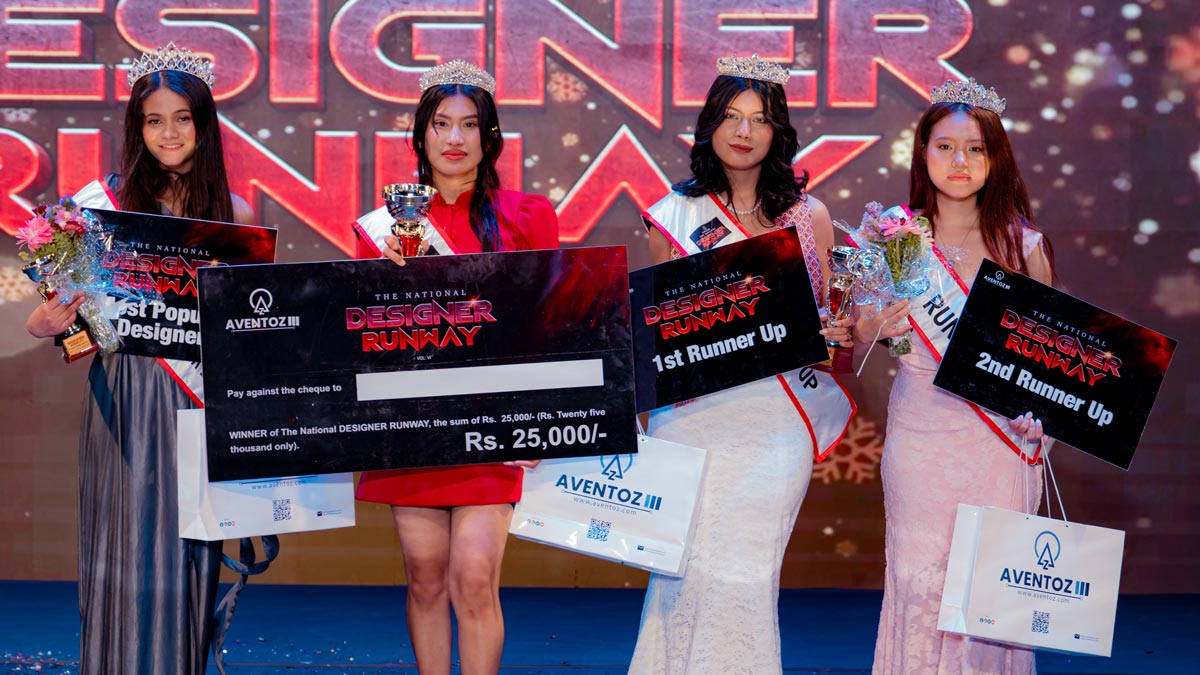 Group photo of National Designers Runway 2026 winners including Aakriti Shrestha, first runner up and second runner up holding awards.