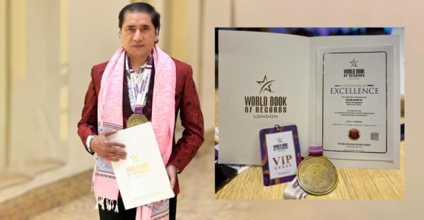 Rojin Shakya Bags Standing pose with Book of Records London Honor