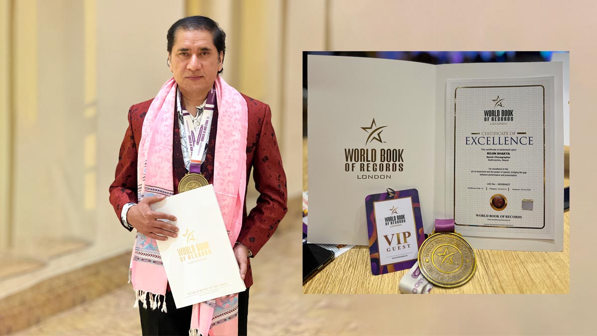 Rojin Shakya Bags Standing pose with Book of Records London Honor